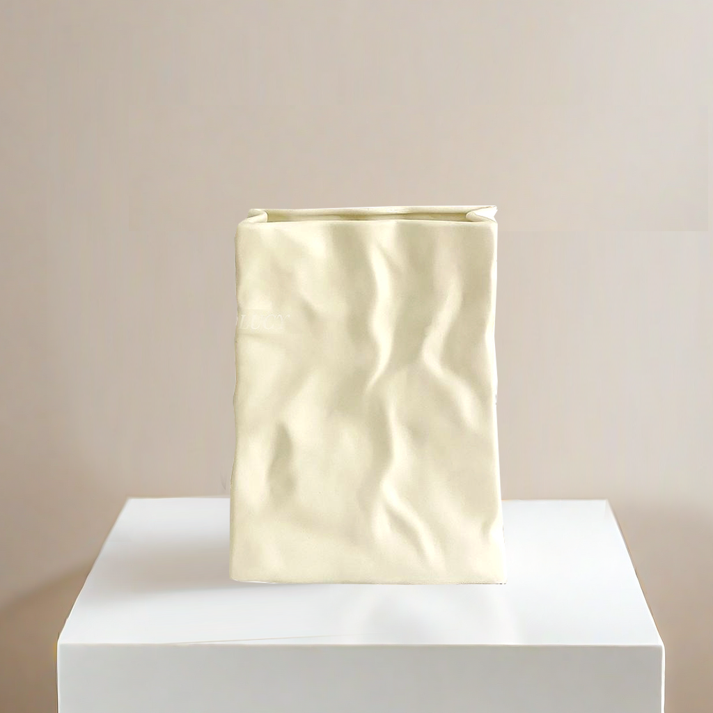 T36 A vase shaped like a white paper bag